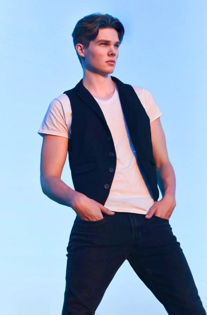 Deric Bucher, vest against sky