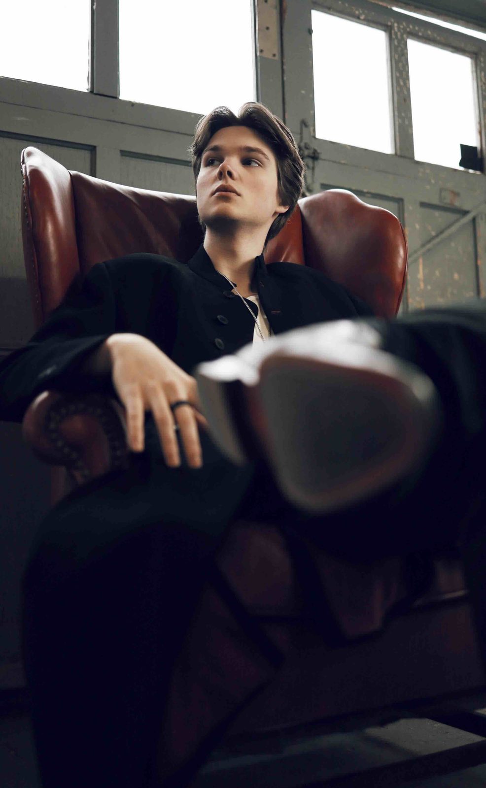 Deric Bucher seated, low angle