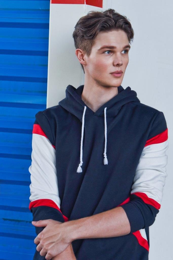 Deric Bucher, hoodie against blue
